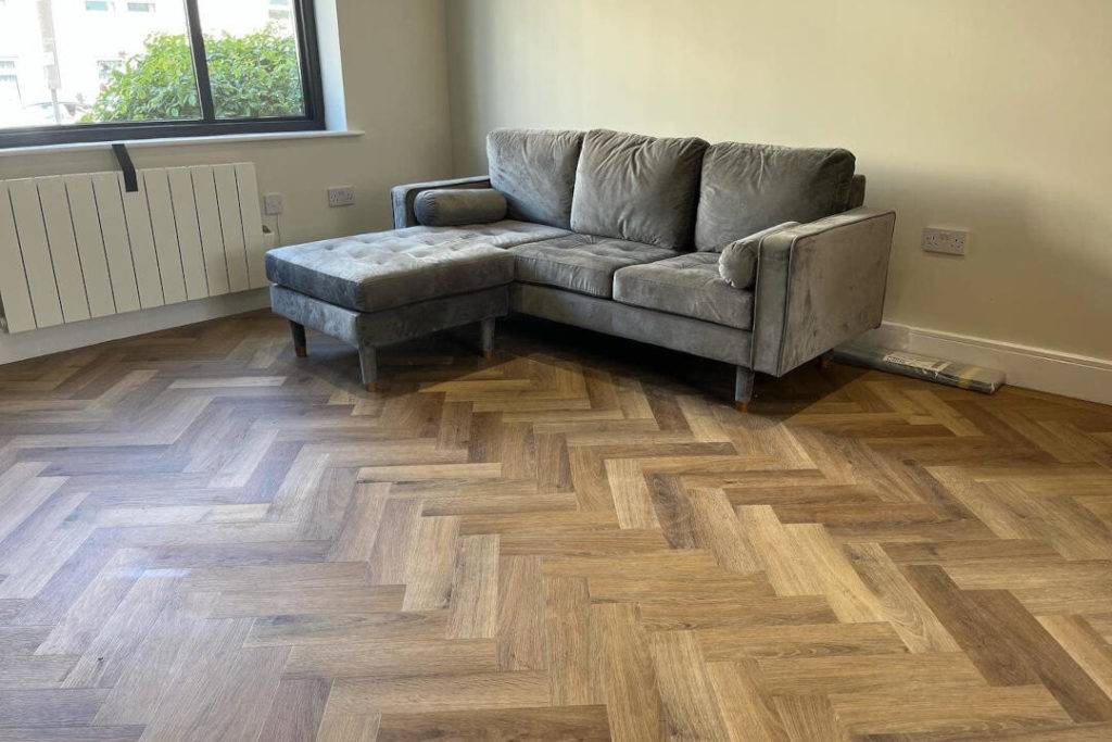 Grey sofa on wood floor